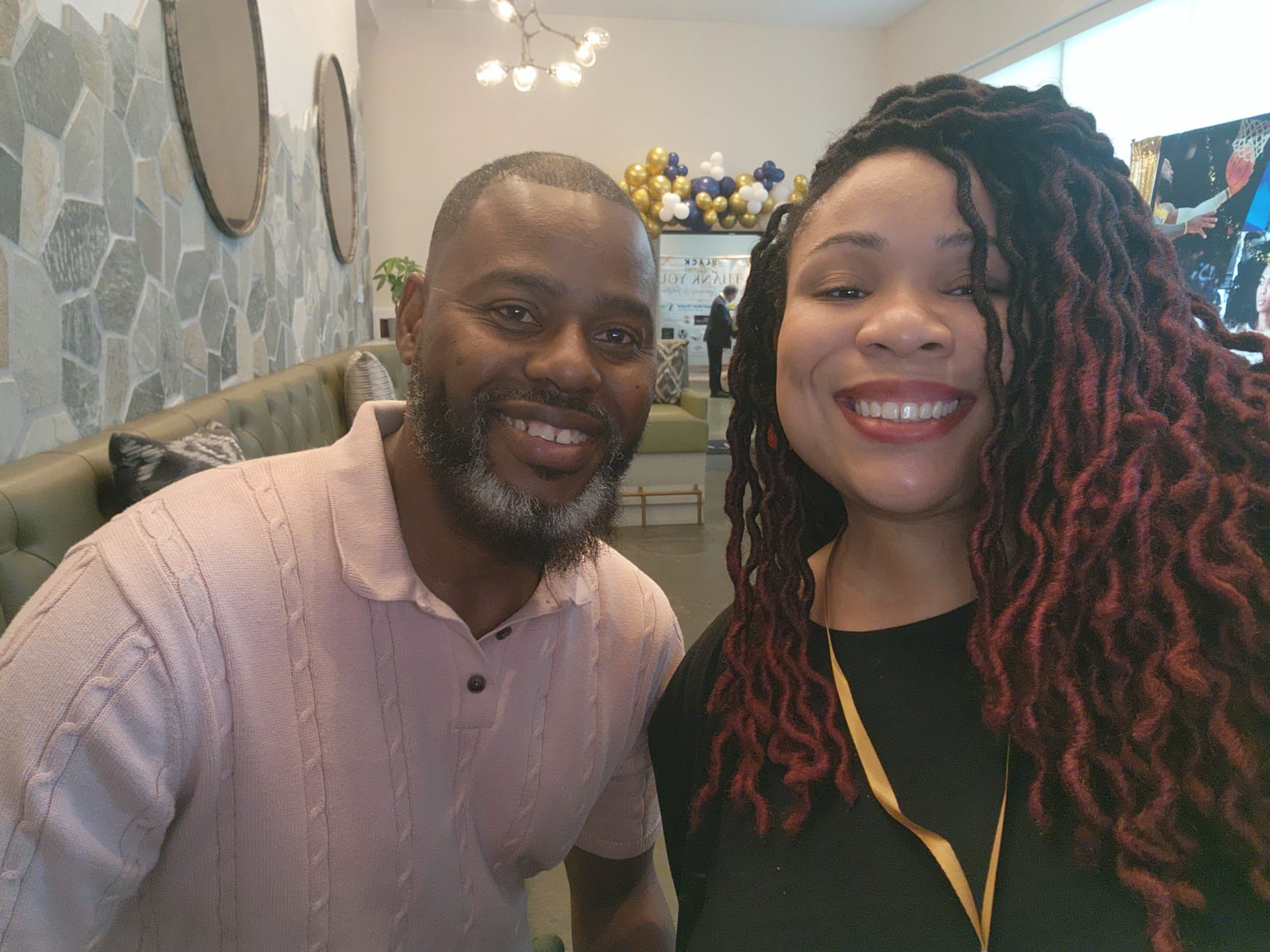 Josa with a client at a community event